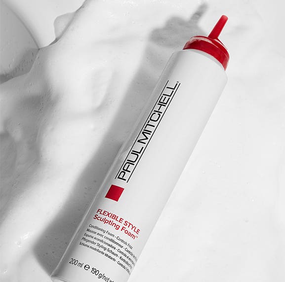 image of Paul Mitchell Flexible Style Sculpting Foam laid upon foamy product texture